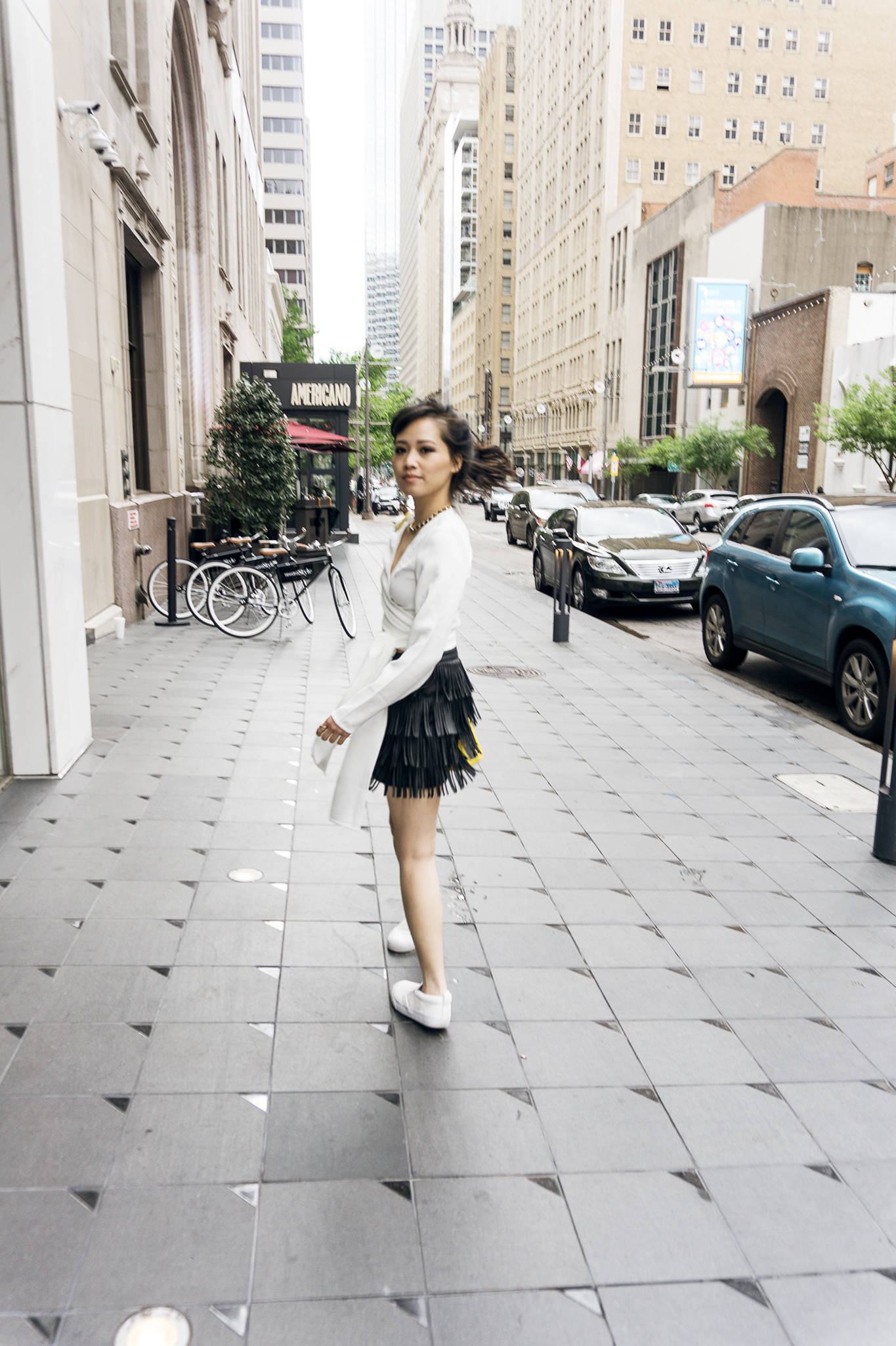 fringe skirt and white sneakers